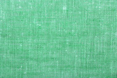 Texture of green burlap fabric as background, top view