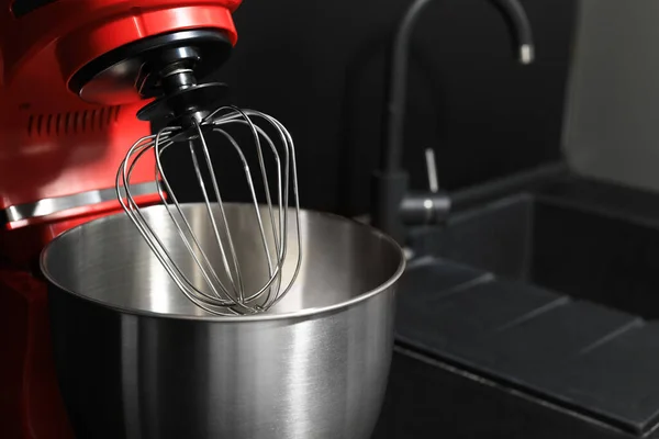 Modern stand mixer on countertop in kitchen, closeup. Space for text