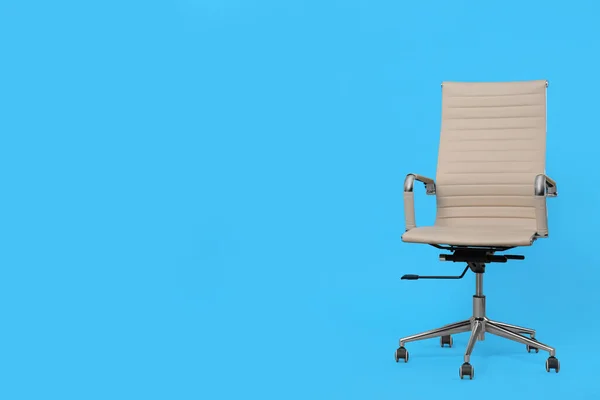 Comfortable office chair on light blue background, space for text