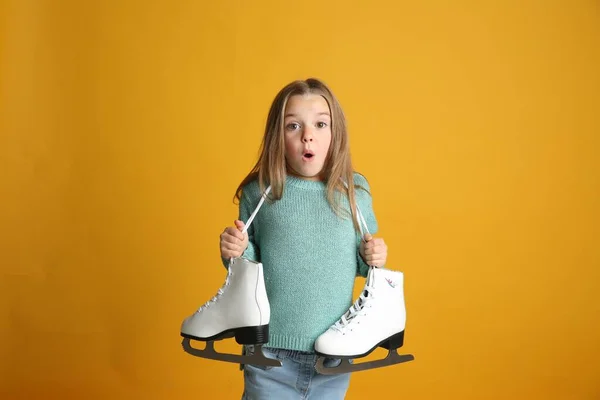 Surprised Little Girl Turquoise Knitted Sweater Skates Yellow Background — Stok fotoğraf