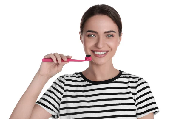 Young Woman Holding Brush Charcoal Toothpaste White Background — Stock fotografie