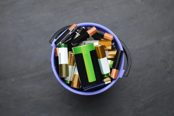 Used Batteries Bucket Black Table Top View — Stock Fotó