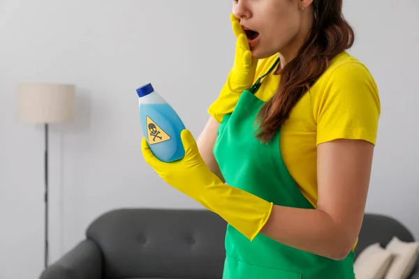 Woman Looking Bottle Toxic Household Chemical Warning Sign Closeup — 图库照片