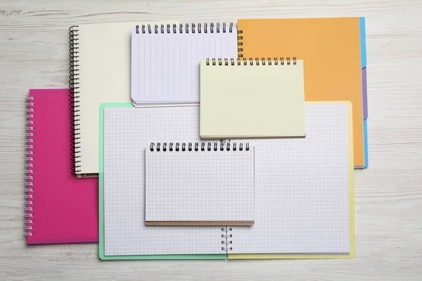 Many Different Notebooks White Wooden Table Flat Lay —  Fotos de Stock