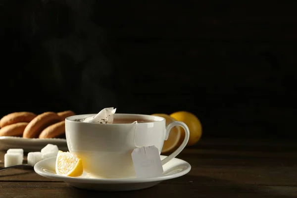 Tea Bag Ceramic Cup Hot Water Lemon Dark Wooden Table — Stock Photo, Image