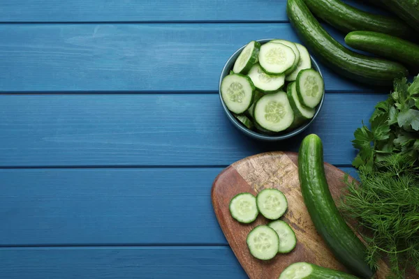 Fresh Ripe Cucumbers Greens Blue Wooden Table Flat Lay Space — Foto de Stock