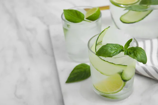 Tasty Fresh Cucumber Water Sliced Lime Basil White Marble Table — Foto de Stock