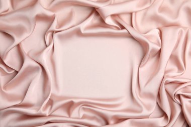 Arka plan olarak narin pembe ipeğin dokusu, üst görünüm