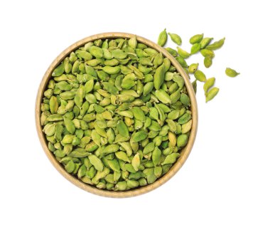 Wooden bowl and dry cardamom seeds on white background, top view