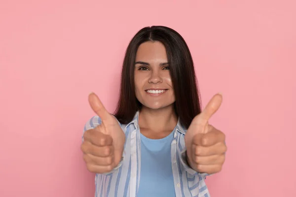 Young Woman Showing Thumbs Pink Background — Zdjęcie stockowe