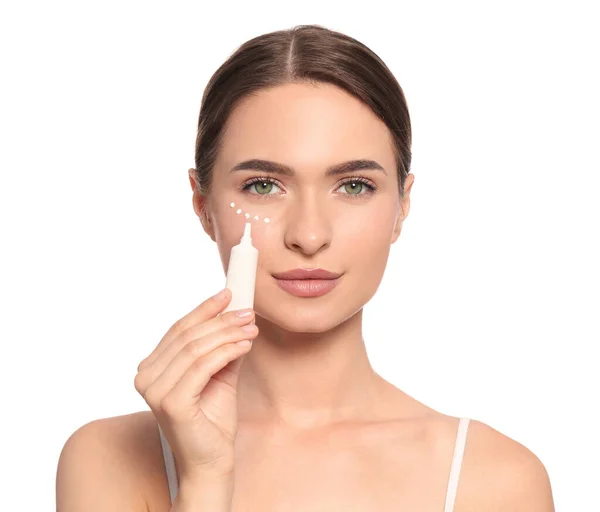 Young Woman Applying Cream Eye White Background — 스톡 사진