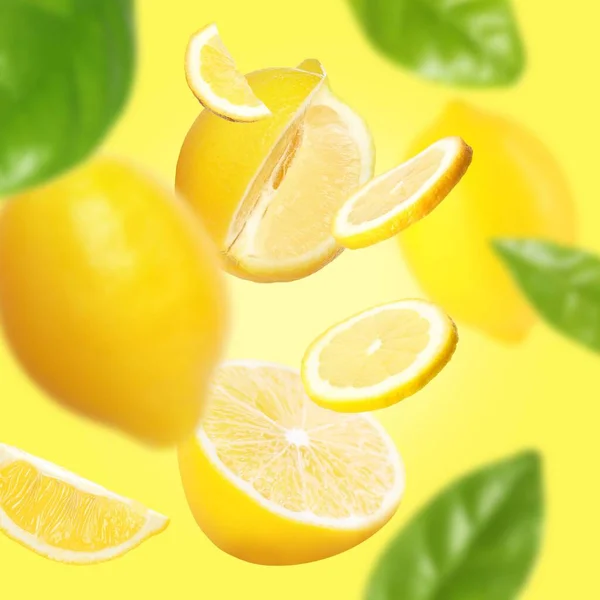 Fresh Ripe Lemons Green Leaves Yellow Background — Stock Photo, Image