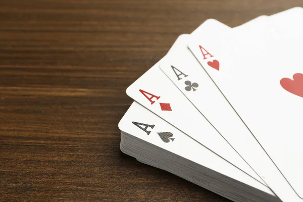 Four Aces Playing Cards Wooden Table Closeup Space Text — Foto de Stock