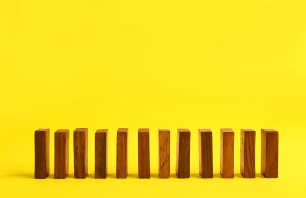 Row Wooden Domino Tiles Yellow Background Space Text — Stockfoto