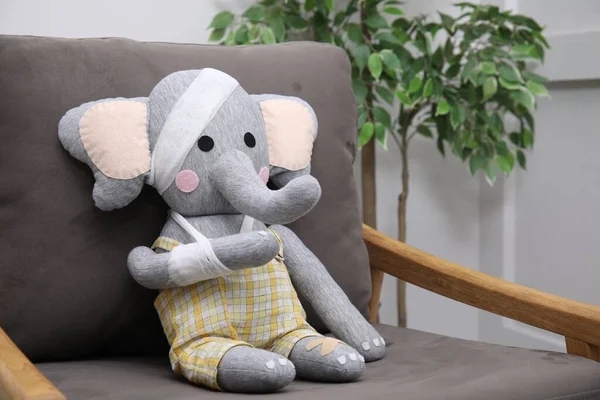 Toy Elephant Bandages Sitting Armchair Indoors —  Fotos de Stock