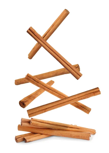 Aromatic Dry Cinnamon Sticks Falling White Background — Stock Photo, Image