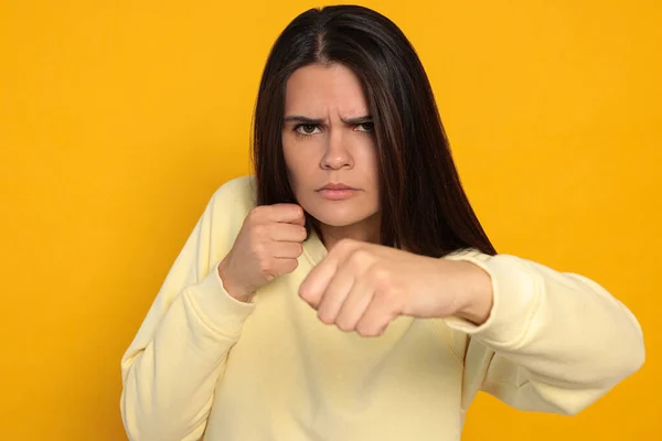 Young Woman Ready Fight Orange Background — Fotografia de Stock