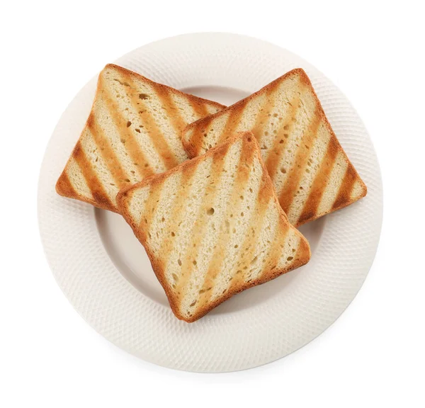 Plate with slices of delicious toasted bread on white background, top view