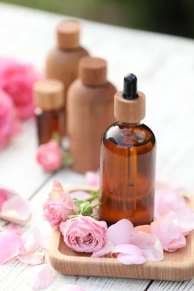 Rose Essential Oil Flowers White Wooden Table — Stok fotoğraf