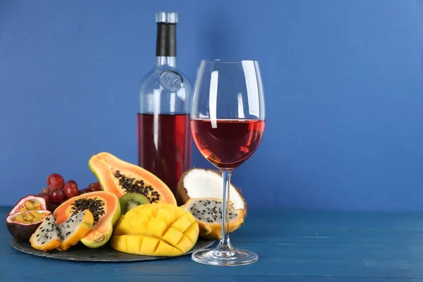 Delicious Exotic Fruits Wine Blue Wooden Table — Stock Fotó