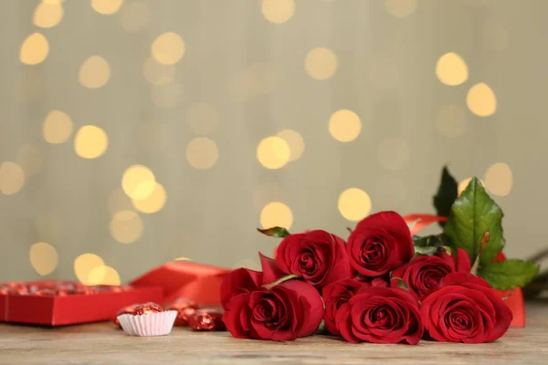 Beautiful Red Roses Candies Table Blurred Lights Space Text Valentine — Stock fotografie