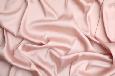 Arka plan olarak narin pembe ipeğin dokusu, üst görünüm