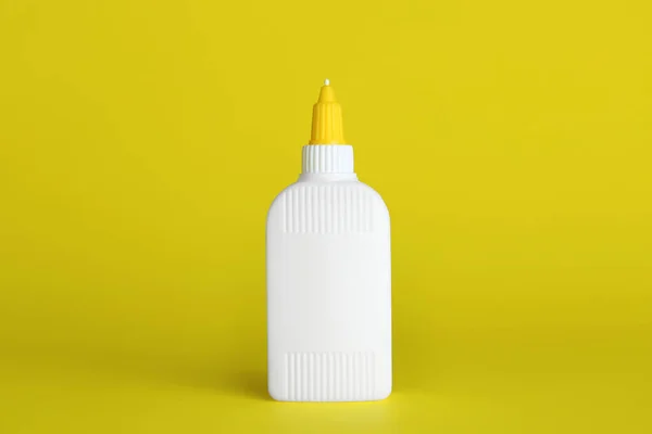 Blank Bottle Glue Yellow Background — Zdjęcie stockowe
