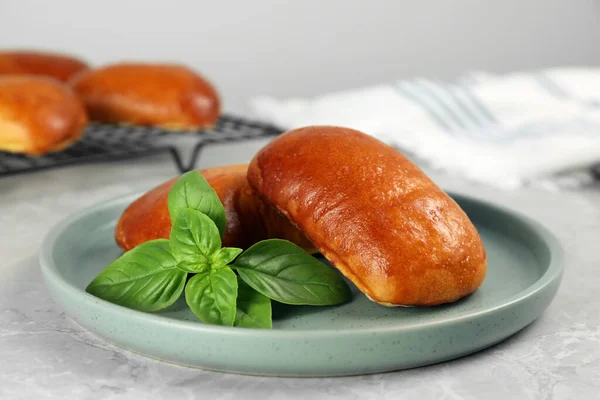 Delicious Baked Pirozhki Basil Light Grey Marble Table Closeup — ストック写真