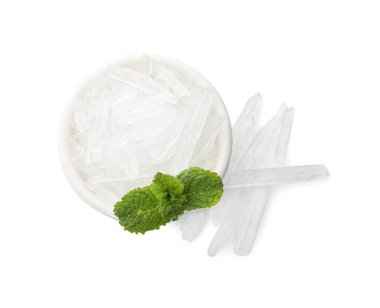 Menthol crystals and fresh mint leaves in bowl on white background, top view