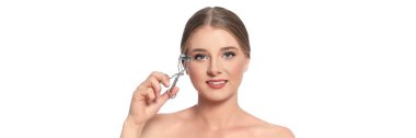 Young woman with eyelash curler on white background. Banner design