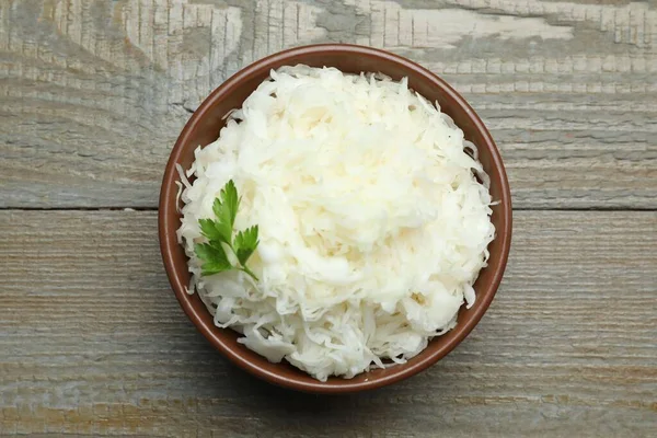 Tasty Fermented Cabbage Parsley Wooden Table Top View — Foto Stock