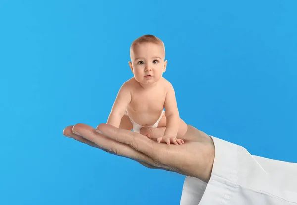 Surrogacy Concept Doctor Holding Cute Little Baby Blue Background Closeup —  Fotos de Stock