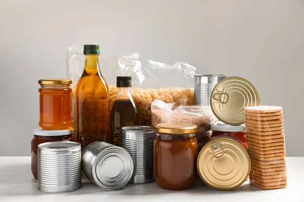 Different Products White Wooden Table Food Donation — Stockfoto