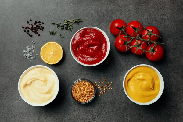 Flat Lay Composition Ketchup Mustard Mayonnaise Ingredients Grey Table — Stockfoto