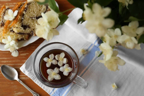 Glass Cup Aromatic Tea Beautiful Jasmine Flowers Dessert Wooden Table — Stock Photo, Image