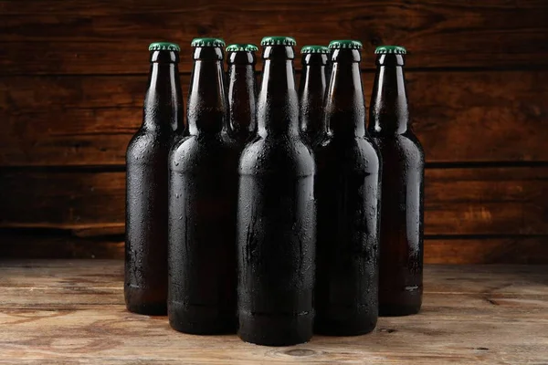 Many Bottles Beer Wooden Table — Stock fotografie