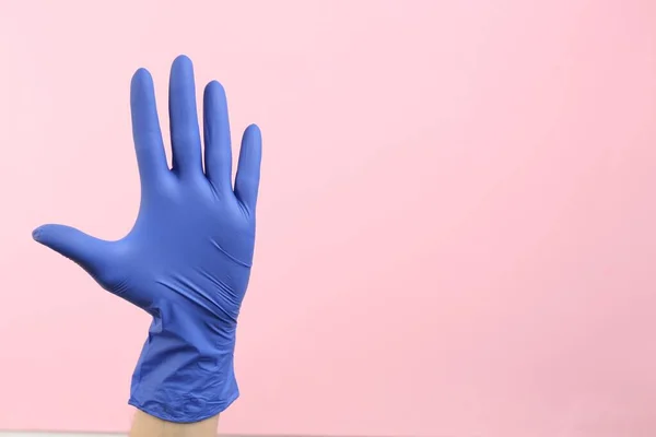 Person Medical Gloves Pink Background Closeup Hand Space Text — Zdjęcie stockowe