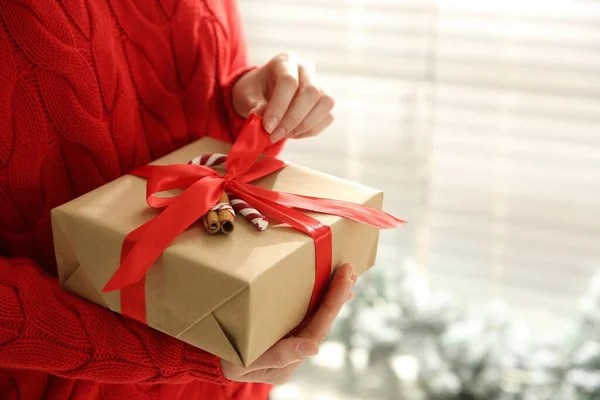 Woman Holding Christmas Gift Box Indoors Closeup Space Text — Foto de Stock