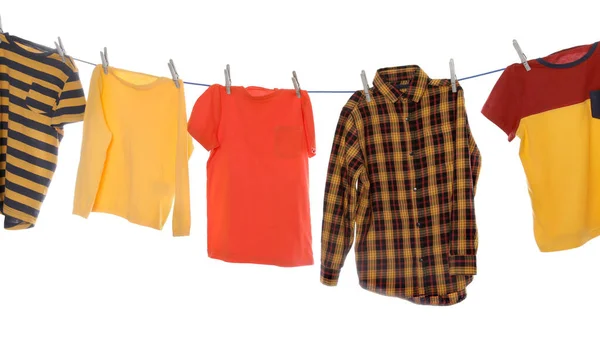 Different Bright Clothes Drying Washing Line White Background — Stock fotografie