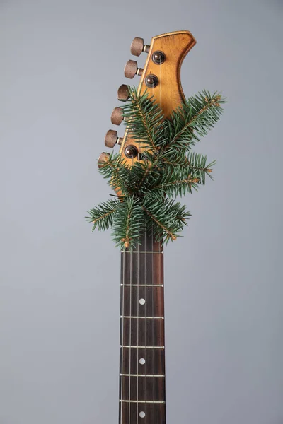 Guitar Fir Tree Branch Grey Background Christmas Music — Stockfoto