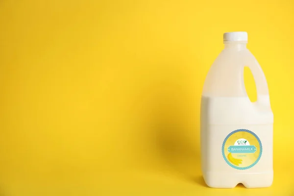 Gallon Bottle Banana Milk Yellow Background Space Text Vegan Product — Photo