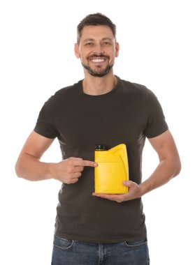 Man pointing at yellow container of motor oil on white background