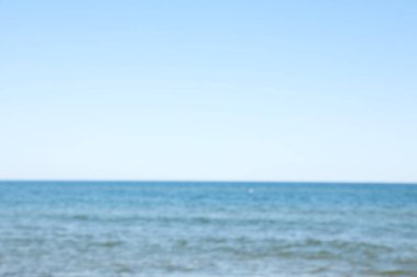 Blurred view of sea on sunny day