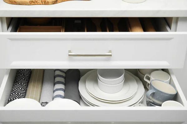 Open Drawers Kitchen Cabinet Different Dishware Towels — стоковое фото