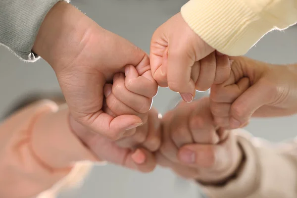 Group People Holding Fists Together Indoors Low Angle View Unity — Stock Photo, Image