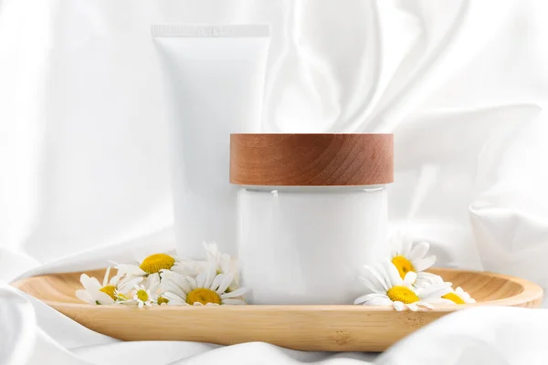Different Hand Care Cosmetic Products Chamomiles White Silk Fabric — Fotografia de Stock
