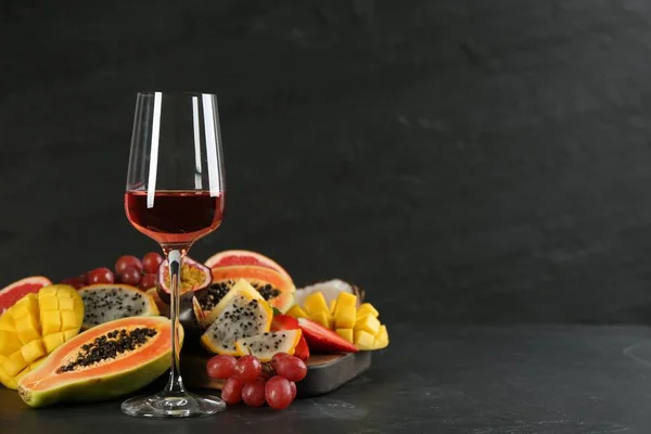 Delicious Exotic Fruits Glass Wine Black Table Space Text — Stock Fotó