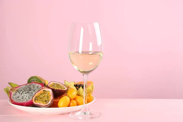 Delicious Exotic Fruits Wine Pink Wooden Table Space Text — Stock Fotó