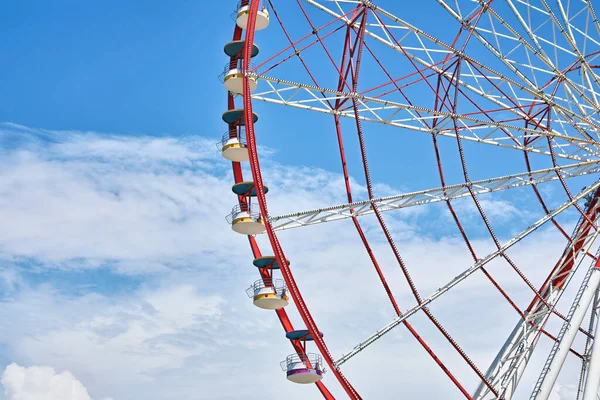 Beautiful large Ferris wheel against cloudy sky