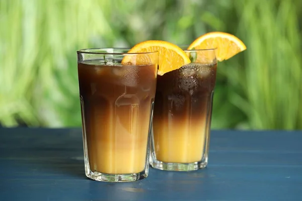 Tasty Refreshing Drink Coffee Orange Juice Blue Wooden Table Blurred — Stock Fotó
